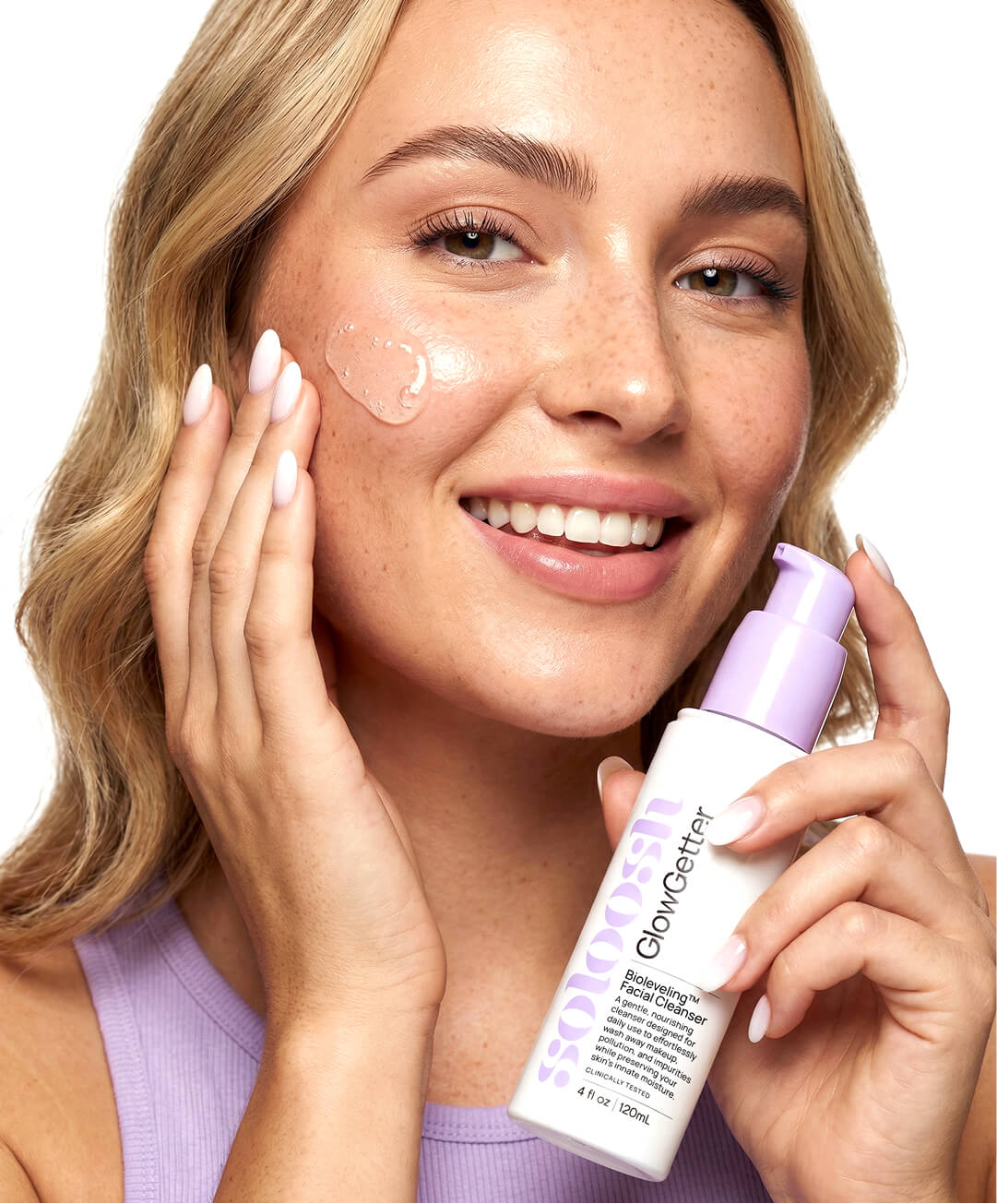 Model applying GlowGetter Bioleveling Cleanser
