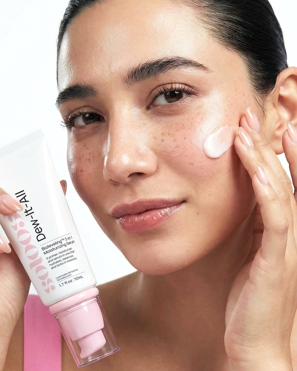 Girl applying Dew It All Bioleveling™ 3-in-1 Moisturizing Serum